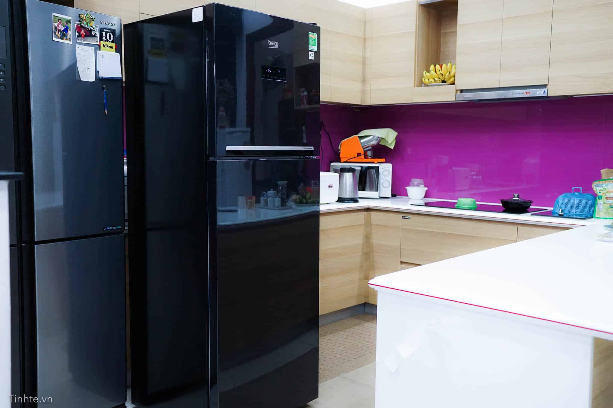 Refrigerator samsung warranty vietnam, black fridge in modern kitchen, Samsung appliance service Vietnam, appliance warranty, Samsung refrigerator support Vietnam.