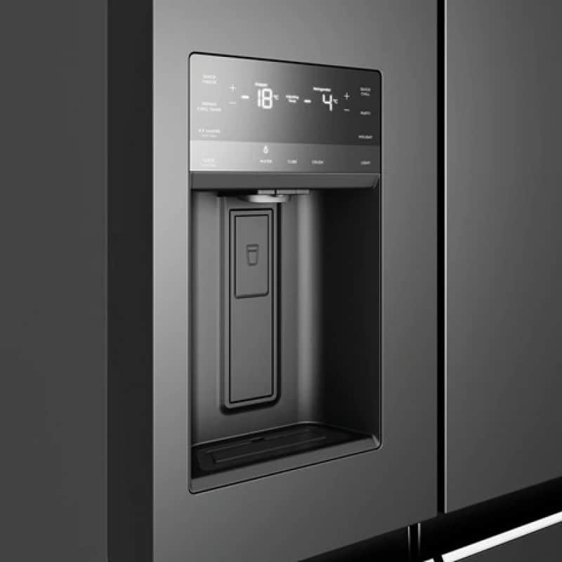High-tech Samsung refrigerator with digital display and water dispenser, modern design, energy-efficient appliance for home use.