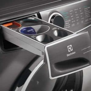 Compact washing machine detergent drawer with Electrolux branding and multiple compartments for laundry products.