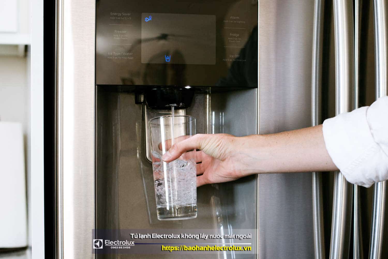 Water dispenser on LG refrigerator, person filling glass with water from LG fridge, household appliance, modern kitchen, cold water dispensing, water filter, water flow, convenient drinking water access, cooling technology, clean water delivery, water filling station, fridge with water dispenser, home water supply, water tap feature, water dispensing system.